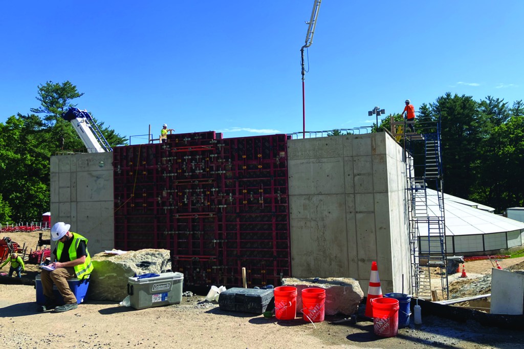 Construction of sludge holding tanks showing rebar and concrete construction