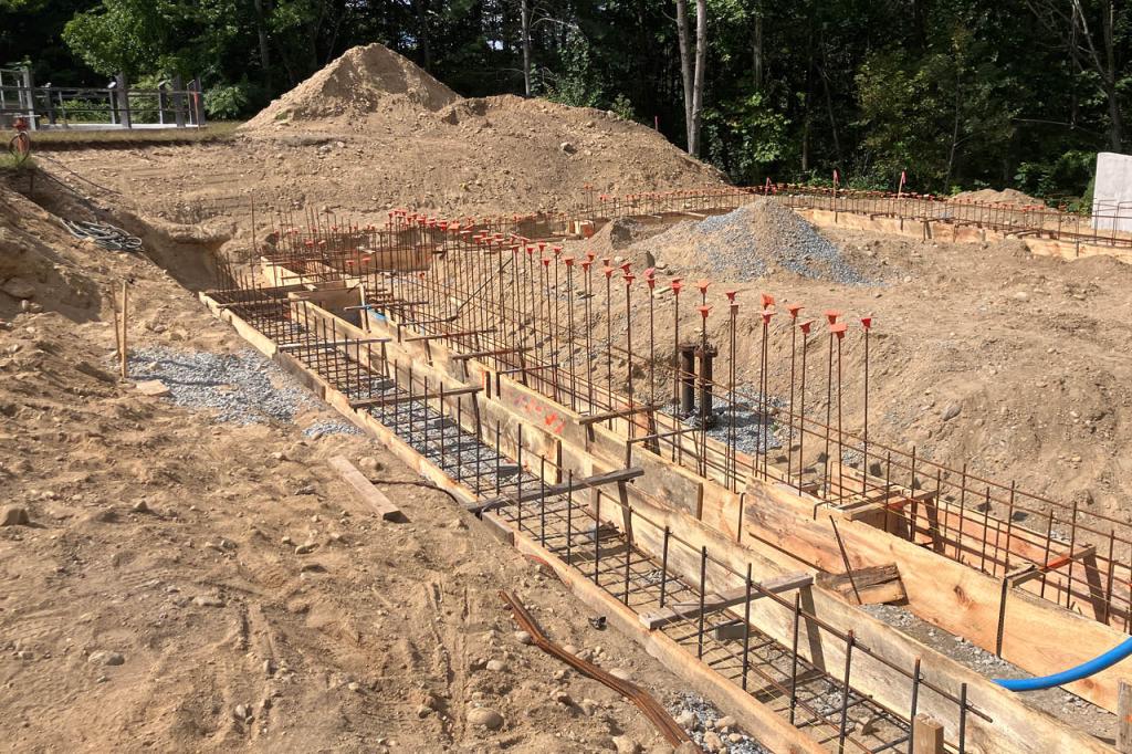 Rebar and wooden forms for the rebar footings on the dewatering building